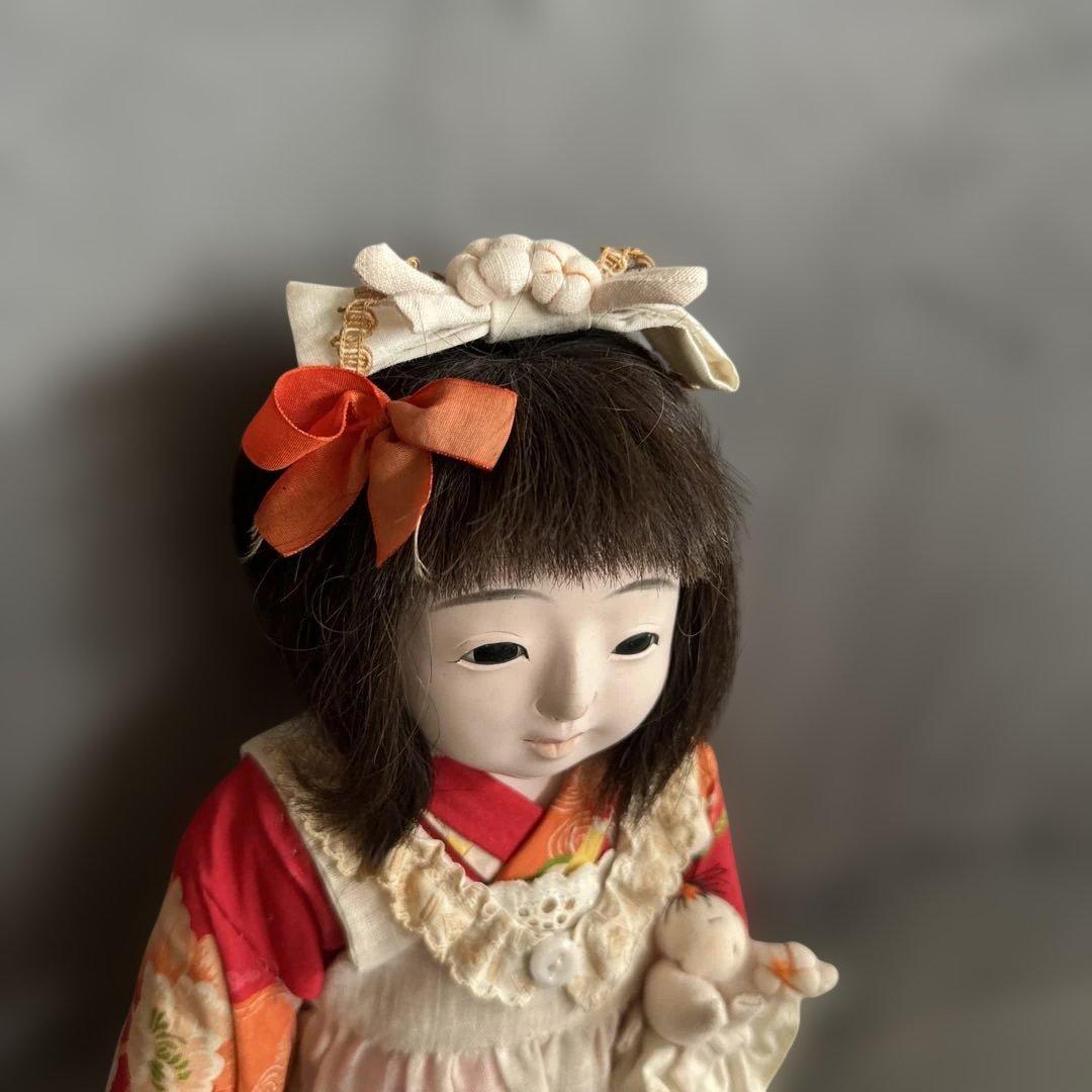 蔵出し　市松人形 赤とオレンジの花柄